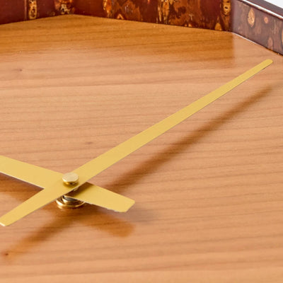Mokuroku 12-sided Japanese wooden wall clock made of cherry wood with minimalist design and brass hands, handcrafted in Japan.