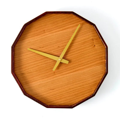 Mokuroku 12-sided Japanese wooden wall clock made of cherry wood with minimalist design and brass hands, handcrafted in Japan.