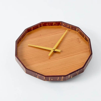 Mokuroku 12-sided Japanese wooden wall clock made of cherry wood with minimalist design and brass hands, handcrafted in Japan.