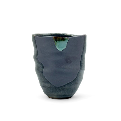 Handcrafted Mino-yaki Yunomi Japanese teacup with traditional glaze, perfect for daily tea rituals.