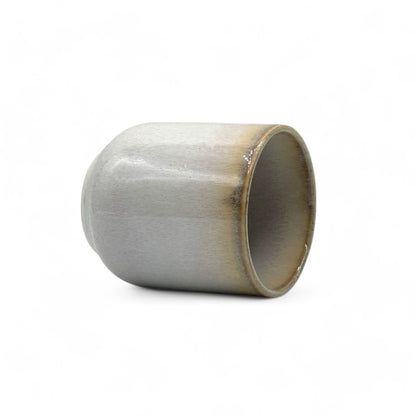 Handcrafted Mino-yaki Yunomi Japanese teacup with traditional glaze, perfect for daily tea rituals.