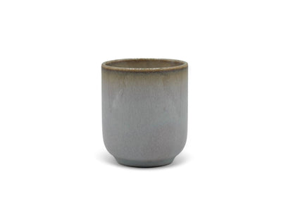 Handcrafted Mino-yaki Yunomi Japanese teacup with traditional glaze, perfect for daily tea rituals.