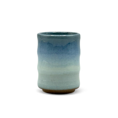 Handcrafted Mino-yaki Yunomi Japanese teacup with traditional glaze, perfect for daily tea rituals.