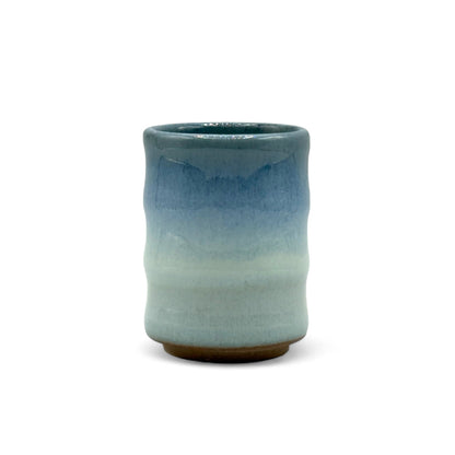Handcrafted Mino-yaki Yunomi Japanese teacup with traditional glaze, perfect for daily tea rituals.