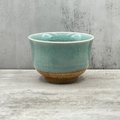 Handcrafted Mino-yaki Yunomi Japanese Sencha teacup with traditional glaze, perfect for daily tea rituals.