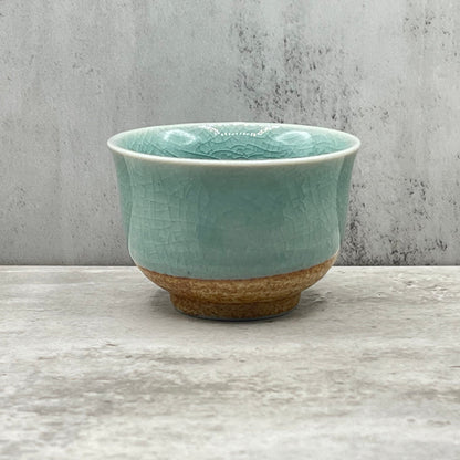 Handcrafted Mino-yaki Yunomi Japanese Sencha teacup with traditional glaze, perfect for daily tea rituals.