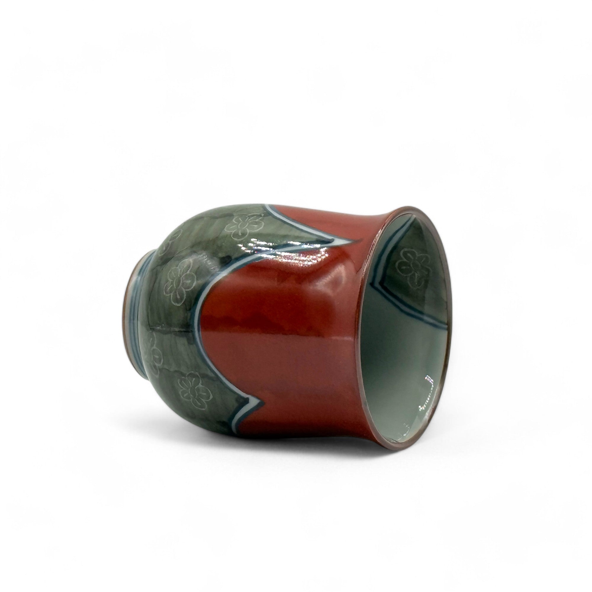Handcrafted Hasami-yaki Yunomi Japanese teacup with traditional glaze, perfect for daily tea rituals.