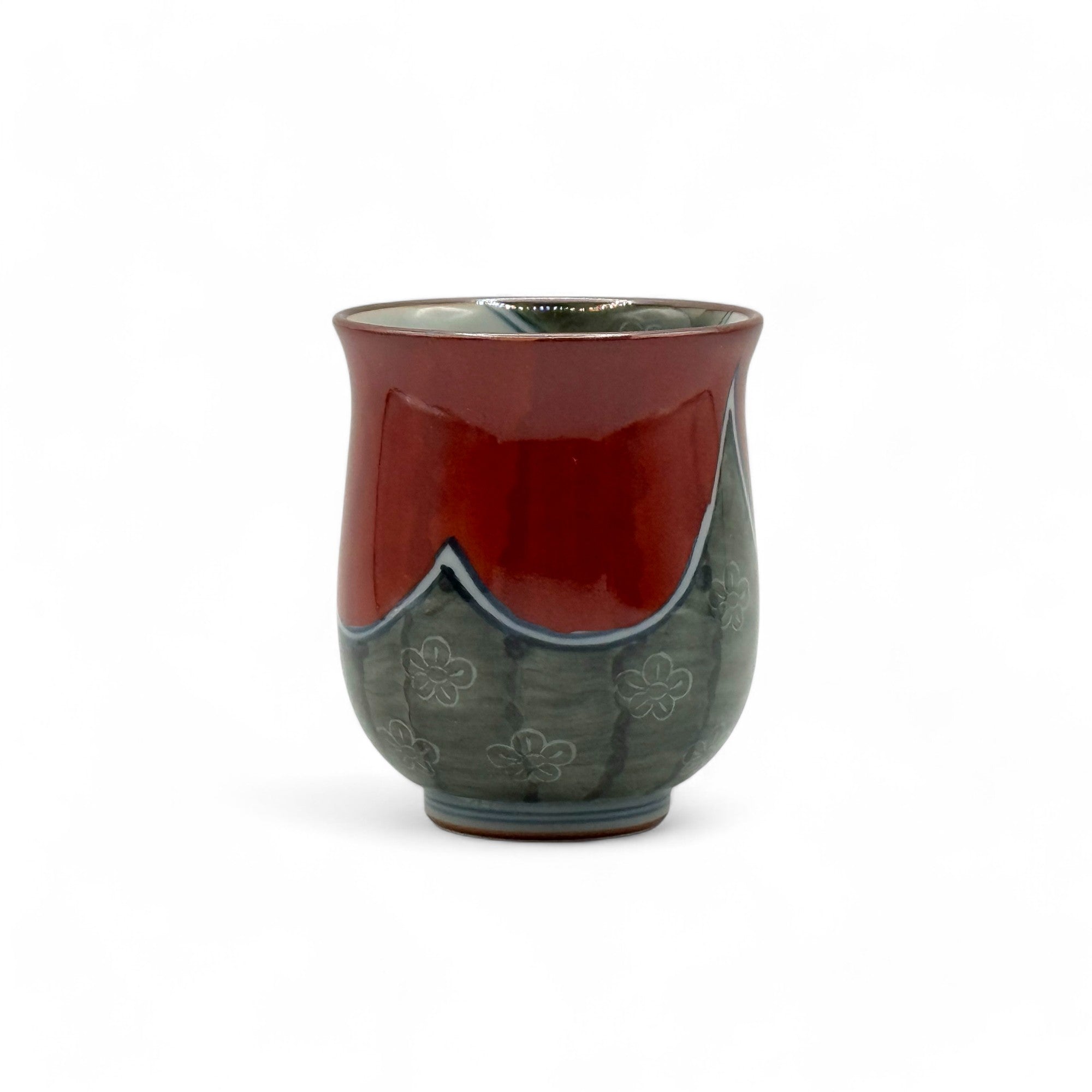Handcrafted Hasami-yaki Yunomi Japanese teacup with traditional glaze, perfect for daily tea rituals.