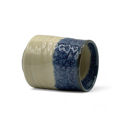 Handcrafted Mino-yaki Yunomi Japanese teacup with traditional glaze, perfect for daily tea rituals.