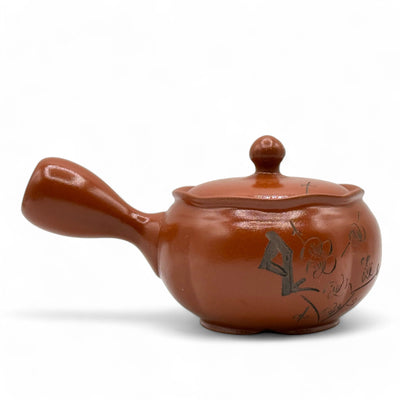 Shuiro red Tokoname-yaki Kyusu Japanese teapot handcrafted in Japan for authentic loose-leaf tea brewing.
