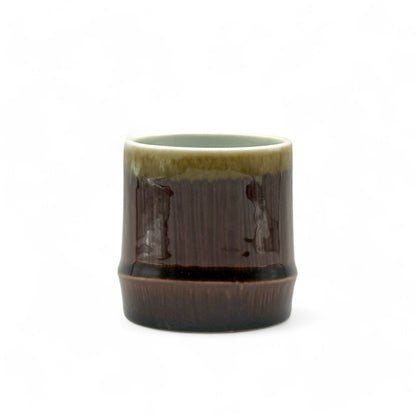Handcrafted Mino-yaki Yunomi Japanese teacup with traditional glaze, perfect for daily tea rituals.