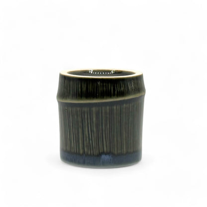 Handcrafted Mino-yaki Yunomi Japanese teacup with traditional glaze, perfect for daily tea rituals.