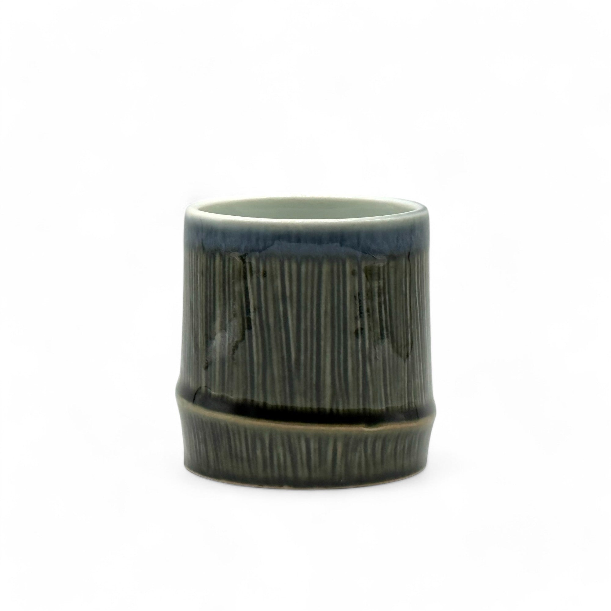 Handcrafted Mino-yaki Yunomi Japanese teacup with traditional glaze, perfect for daily tea rituals.